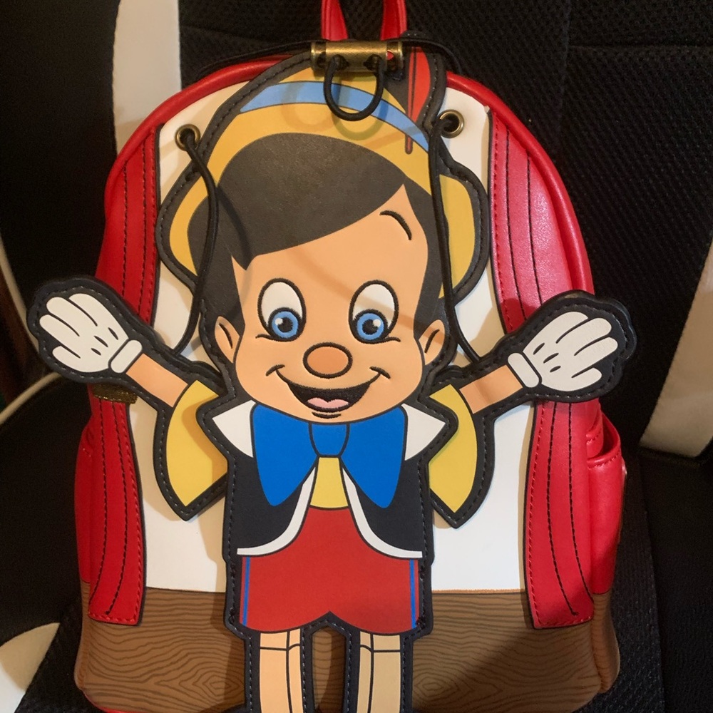Pinocchio loungefly backpack with moving arms and matching loungefly wallet - Picture 6 of 16